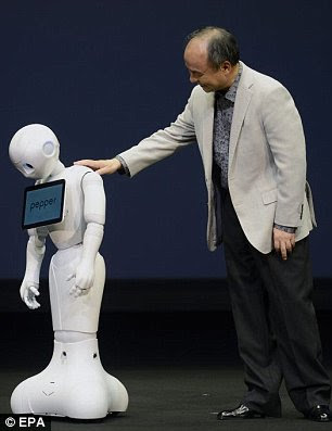 epa04240211 SoftBank CEO and chairman Masayoshi Son interacts with humanoid robot 'Pepper' during its unveiling at a press event held near Tokyo in Urayasu, Chiba prefecture, Japan, 05 June 2014. Capable of interacting through emotions and body langage, Pepper is the described by the developers as the 'World's first personal robot that reads emotions.' It will be on sale from February 2015 for a base price of 198,000 JPY (1,930 USD). The robot was developed in collaboration with French company Aldebaran Robotics.  EPA/FRANCK ROBICHON
