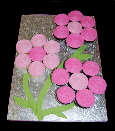 3 pink flowers made from cupcakes