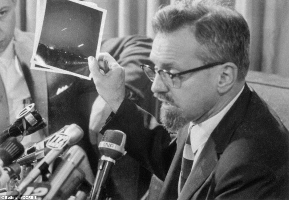 Thanks to the rise in popularity of sci-fi films and an increase in UFO sightings, aliens were very much in the public consciousness in the 1960s. Here, Dr H Allen Hyneck, an astrophysicist at  Northwestern University says at a press conference in 1966, that a photo claiming to show a UFO is a time exposure of the crescent moon and the planet Venus