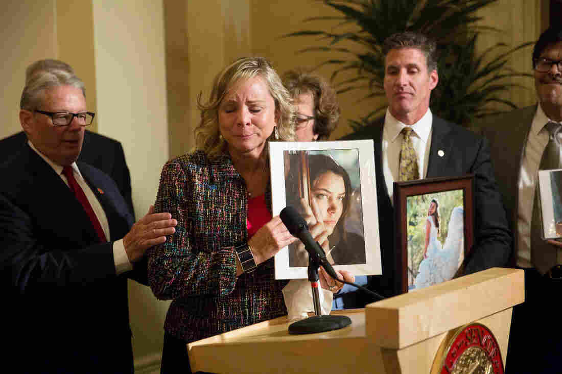 Debbie Ziegler holds a photo of her late daughter, Brittany Maynard, while speaking to the media in September after the passage of California's End Of Life Option Act. Maynard was an advocate for the law.