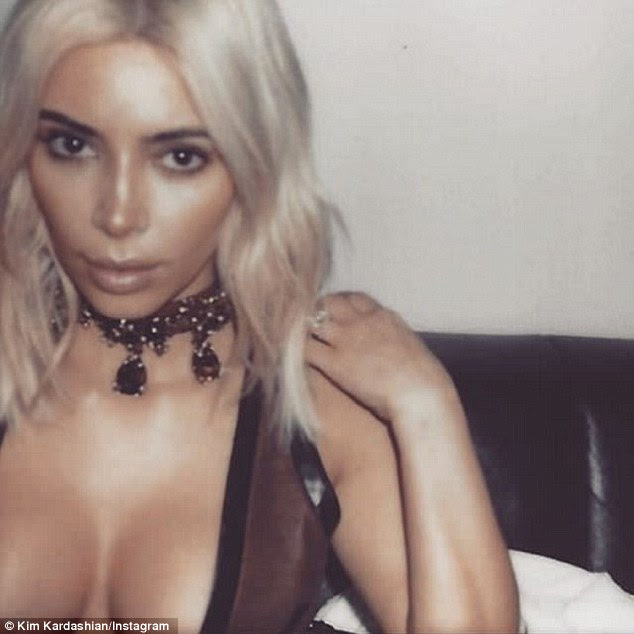 More to love: And yet just after Midler took her claws out, Kim posted yet another sexy snap, this time in a low-cut top showing off her decolletage. The caption read: 'Paris flashback BTS on my app!'