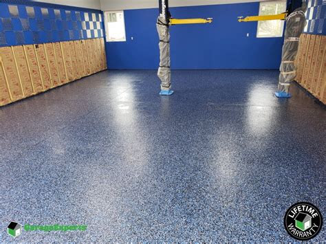 If you've got a concrete floor in need of an overhaul, installing epoxy flooring onto the concrete surface can be an ideal way to give it a new life. Residential Garage Epoxy Flooring in Lake Geneva, Wi