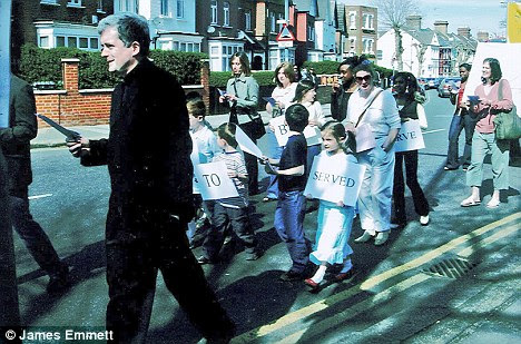 On the march: Father Hugh MacKenzie leads a previous parade