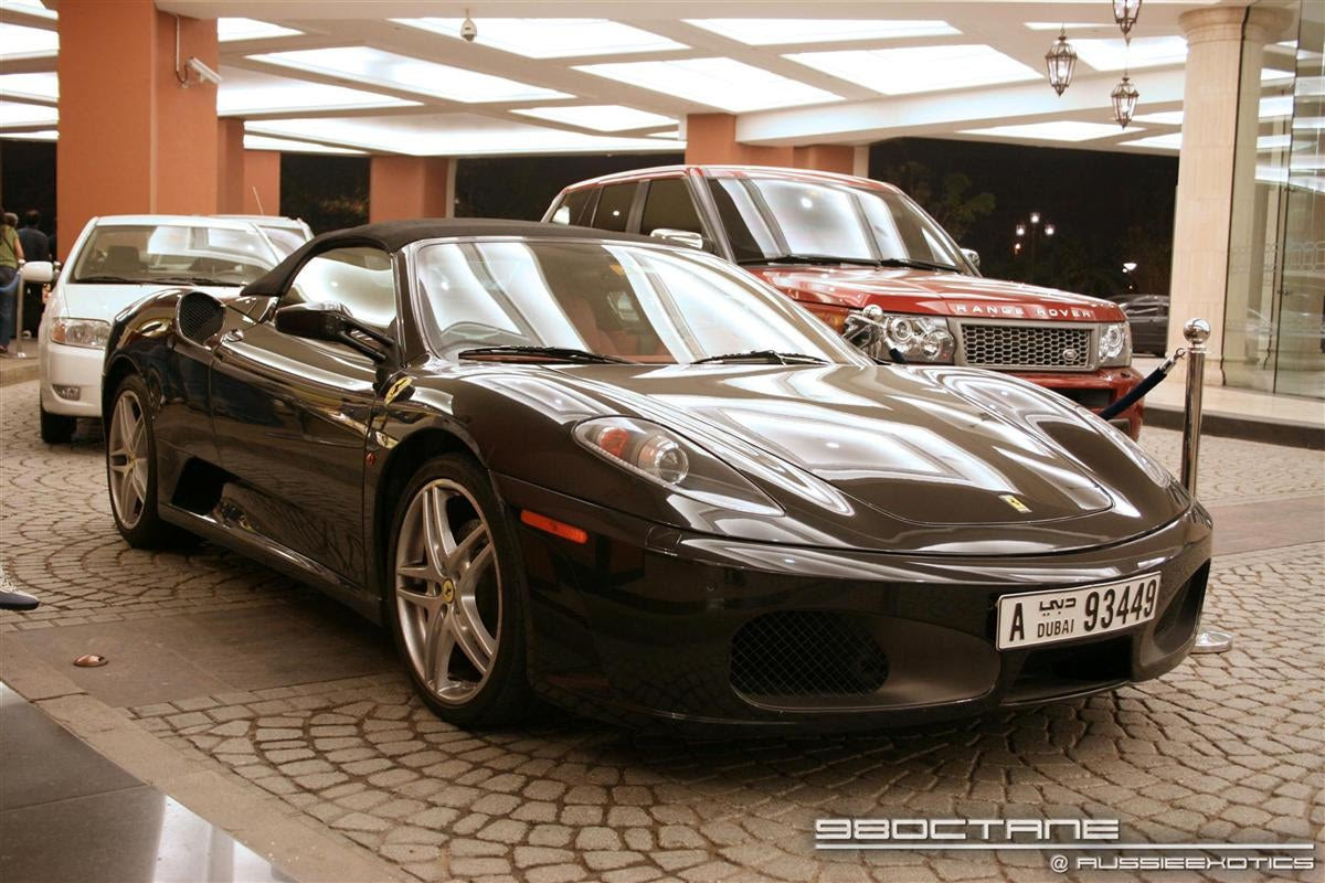red ferrari with black rims