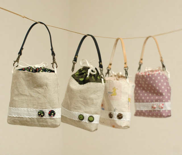 Petit pouch with leather strap