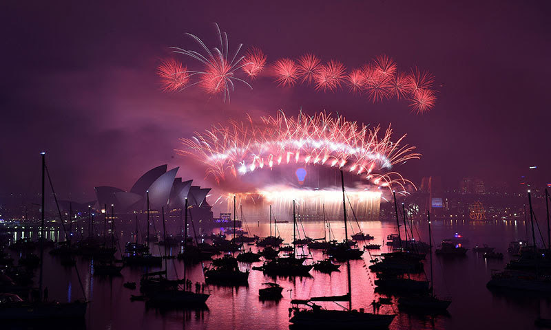 New Year's fireworks erupt over Sydney's iconic Harbour Bridge and Opera House during the traditional fireworks at midnight. -AFP Photo