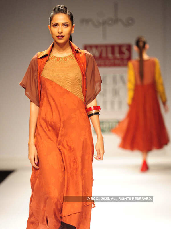 A model walks the ramp for fashion designers Kiran and Meghna on Day 5 of the Wills Lifestyle India Fashion Week (WIFW) 2013, held in Delhi.