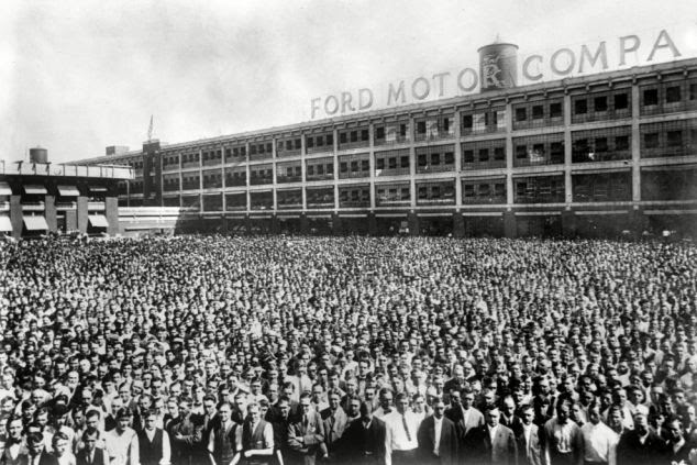 Thriving business: A gathering of workers in the yard of the Ford factories between the two wars 