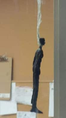 The 45-centimetre high black statue, which Leon’s carries in stock, was hanged by the neck with electrical tape. It’s eyes were painted white in what a human rights lawyer calls “blackface” style. 