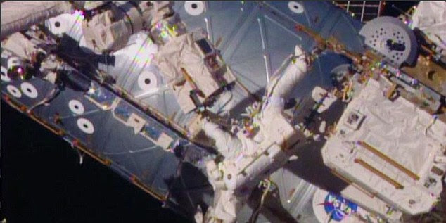 Astronauts are currently floating outside the International Space Station in the second of three spacewalks to prepare parking spots for future 'space taxis'