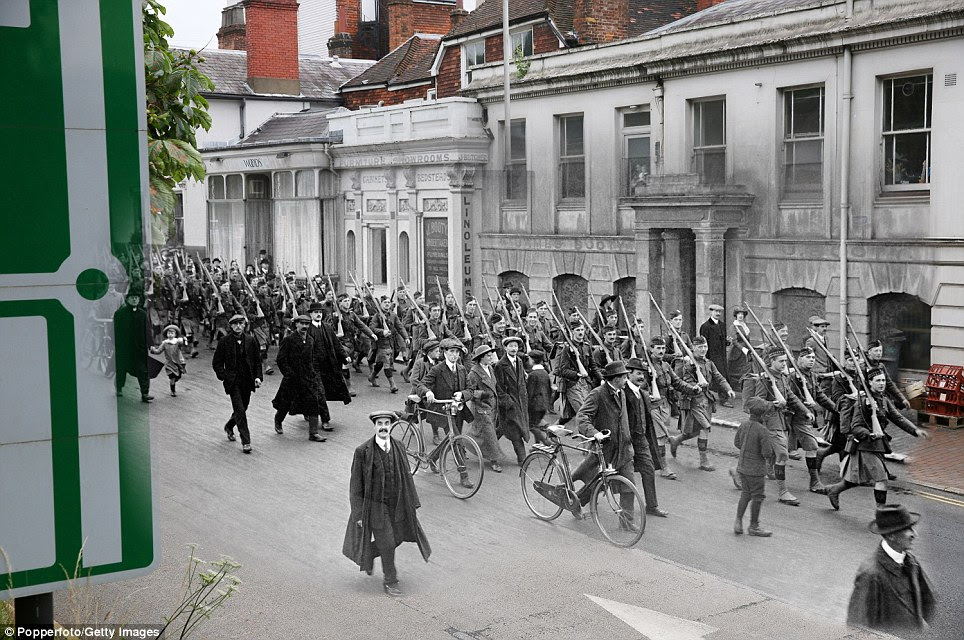 Off they go: Departure of the Liverpool Scottish Regiment for the front from Royal Tunbridge Wells in Kent in 1914, and a modern-day road sign