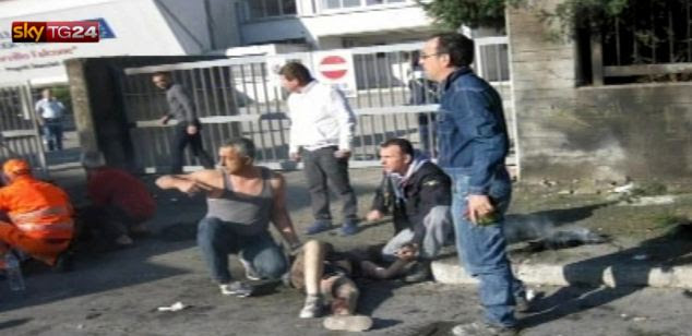 Rescue: A woman receives first aid after the explosion outside Francesca Morvillo Falcone high school