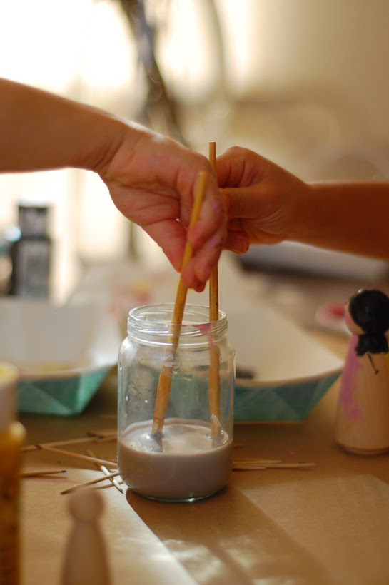 painting wood dollies of themselves