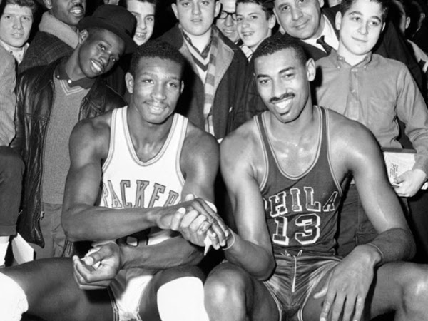 Wilt Chamberlain (right) star basketball player for the Philadelphia Warriors and Walt Bellamy, Chicago Packers´ rookie sensation, pose together prior to ballgame between their teams, March 15, 1962 in Chicago. Bellamy, a Hall of Fame center who ended his career averaging 20.1 points and 13.7 rebounds in 14 seasons in the NBA, died Saturday. He was 74. <br /><br />
