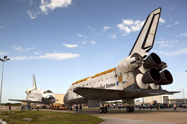 Endeavour and Atlantis are about to come nose-to-nose as they switch places inside the VAB and OPF-2 at KSC on August 16, 2012.