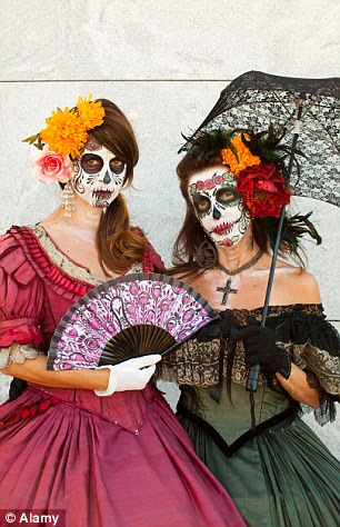A face-painted couple mark Mexican Day Of The Dead at the Forever Cemetery