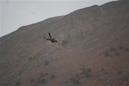 A Turkish military helicopter flies over the border of an area 
between Iraq and Turkey during a military operation against PKK Kurdish 
militants October 25, 2011. Picture taken October 25, 2011. 
REUTERS/Stringer