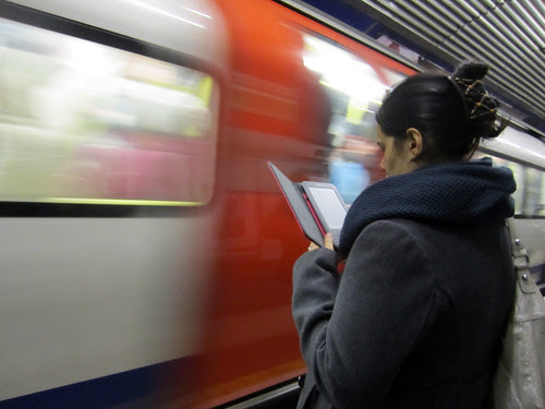 Reading Kindle at Old Street Tube