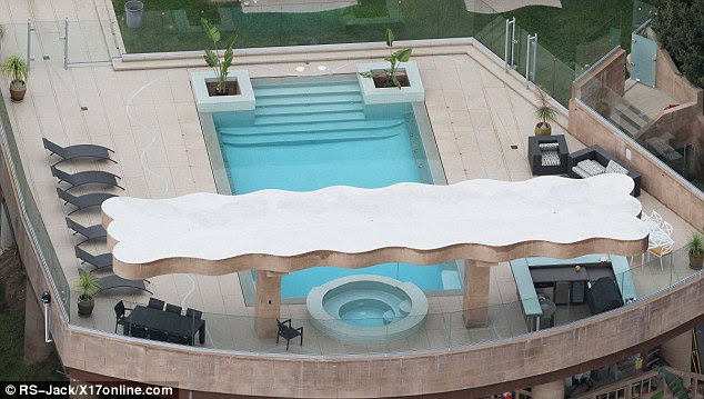 Making a splash: Rihanna has a super wide zero edge swimming pool to host shindigs at that come equipped with a poolside bbq and bar