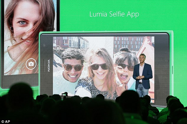 Chris Weber of Microsoft, shows off the new Lumia Selfie App at the consumer electronic fair IFA in Berlin. 'I think we have to amplify the message around security regarding these cloud services,' Weber told reporters.