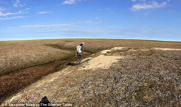Pictured is the undulating ground near the craters. Gases frozen in the ground for thousands of years are suddenly released