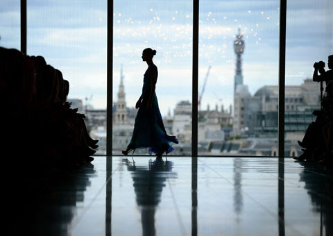 A model presents a creation by Matthew Williamson during the London Fashion Week