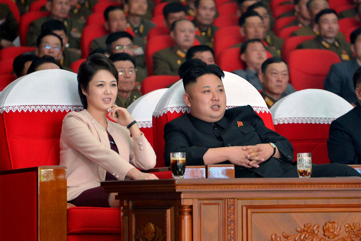 North Korean leader Kim Jong Un and his wife Ri Sol Ju watch a performance by the Moranbong Band at the April 25 House of Culture in Pyongyang