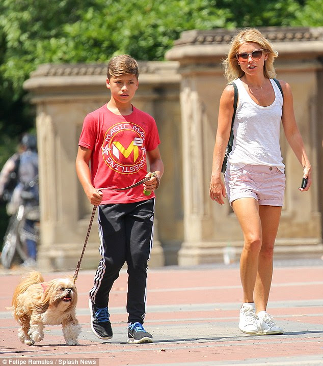 Kelly Ripa and her son Joaquin take the family dog for a ...