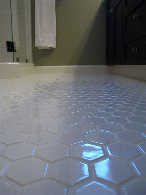 Tennessee state university extension suggests cleaning the grill each time you use it. White Hex tile bathroom floor. Keep the white grout clean