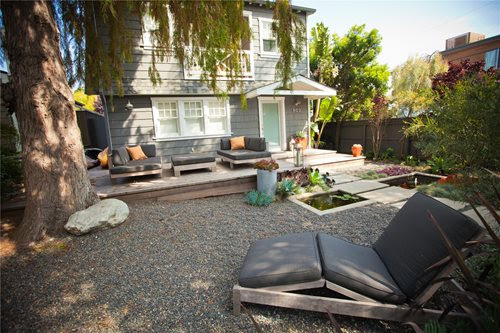 Designed to be low maintenance, this front garden has massed plantings ...