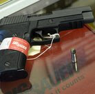 A Sig Sauer handgun on sale at a shop in Tucker, Ga.