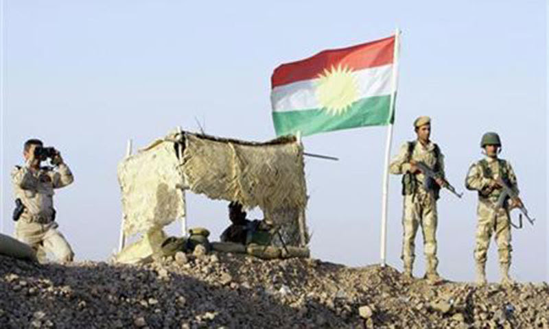 Kurdish Peshmerga soldiers look on at a guard post during a deployment in the area near the northern Iraqi border with Syria. — Reuters/File