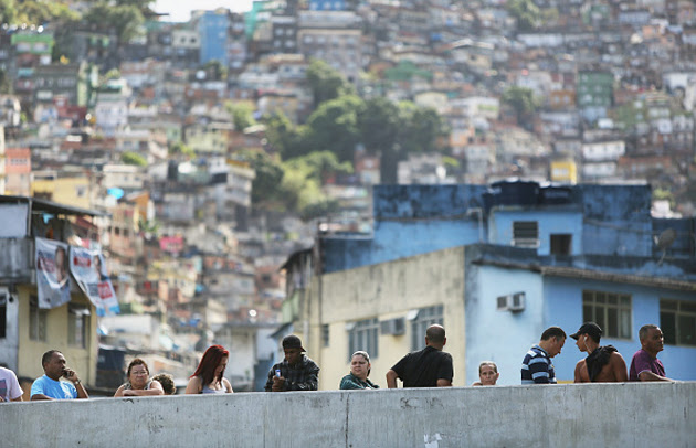 People wait in line to vote in the Rocinha favela