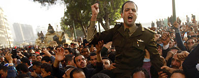 An army officer who joined anti-government protester chants slogans, in downtown Cairo, Egypt, Saturday, Jan. 29, 2011 (AP Photo/Khalil Hamra)