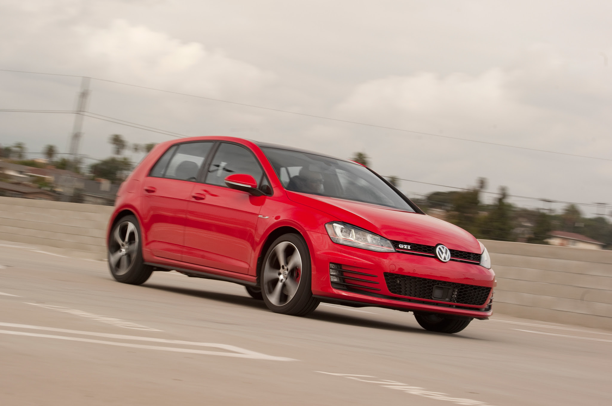 2015-Volkswagen-Golf-GTI-front-three-quarter-in-motion-021