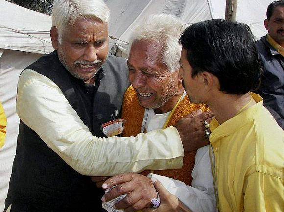 Relatives mourning the death of a family member at the stampede in Haridwar