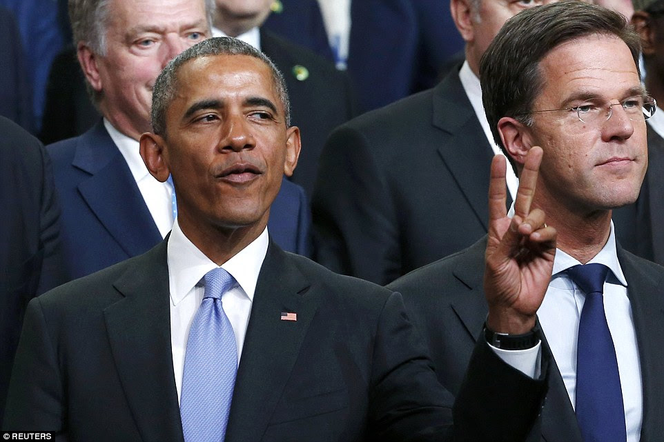 Cool customer: Despite facing criticism for appearing too relaxed in his final year as president, Obama looked chilled as he posed for the photograph while pulling out the peace sign