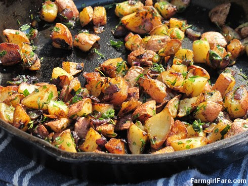(18-14) Pan fried new potatoes with red onion and herbs from the kitchen garden - FarmgirlFare.com