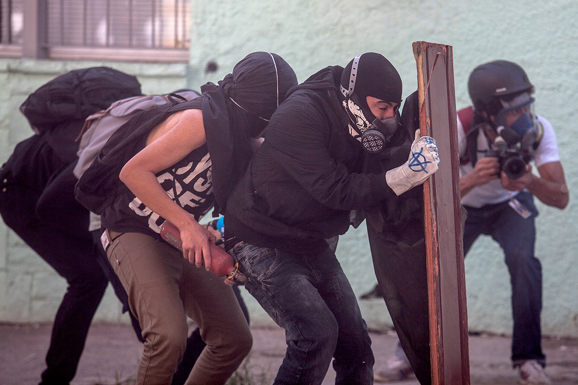 Demonstrators from the anarchist group Black Bloc clash with police in Sao Paulo.
