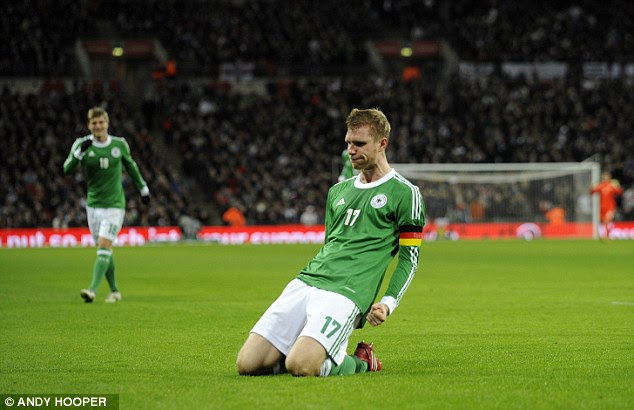 Loving it: Arsenal's centre back enjoyed his goal and produced a knee-slide celebration