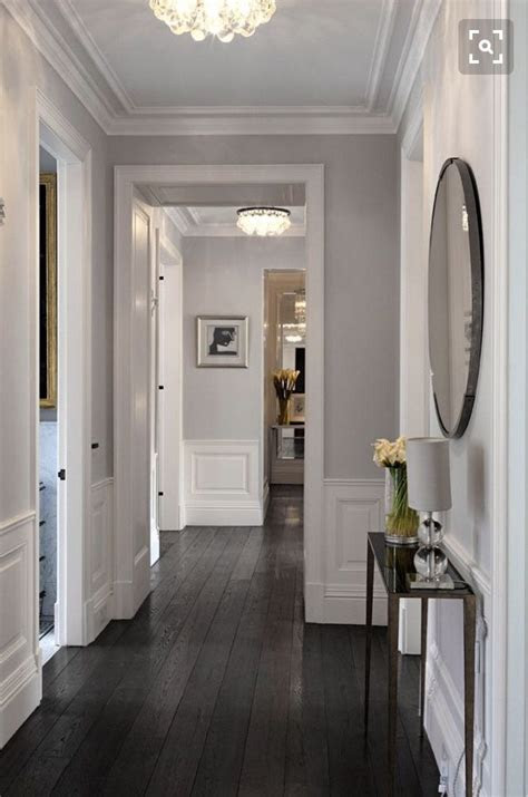 Many times people find out too late. Dark oak hardwood flooring hallway | Living room wood