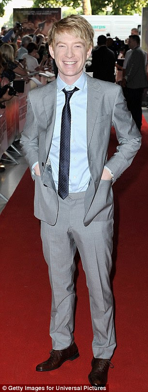 In great spirits: The actor seemed on top of the world as he grinned and pulled faces for the cameras