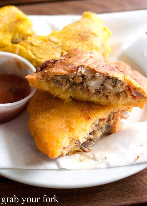 arepa de huevo corn cake filled with beef omelette at Colombia Organik Sydney