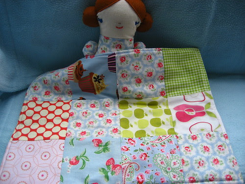 Alana's doll with her quilt