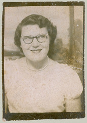 Photobooth girl with glasses and pearls