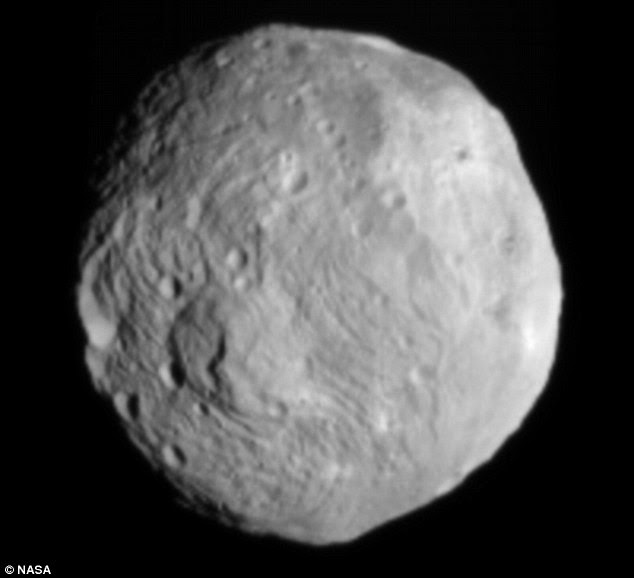 Close encounter: Vesta was photographed by the Dawn space probe in unprecedented detail as it approached a few days ago