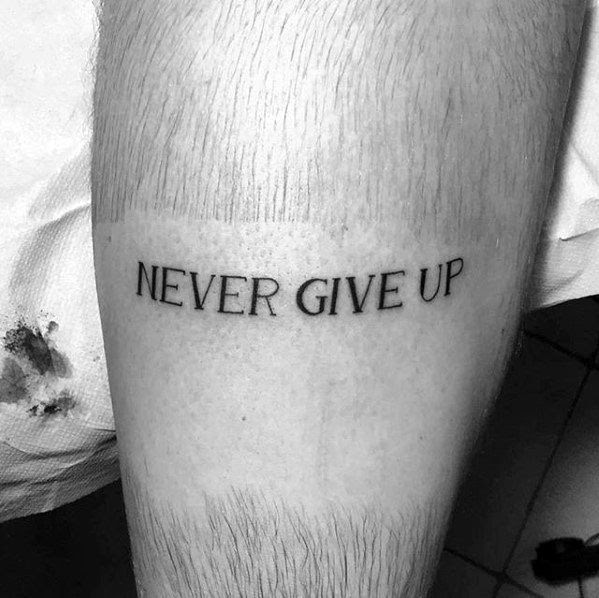 60 Never Give Up Tattoos For Men - Phrase Design Ideas