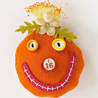 Orange pumpkin pincushion