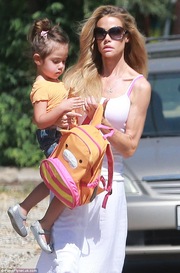Mum and bub: Denise Richards was spotted running some errands in Los Angeles with her adopted daughter Eloise on Tuesday