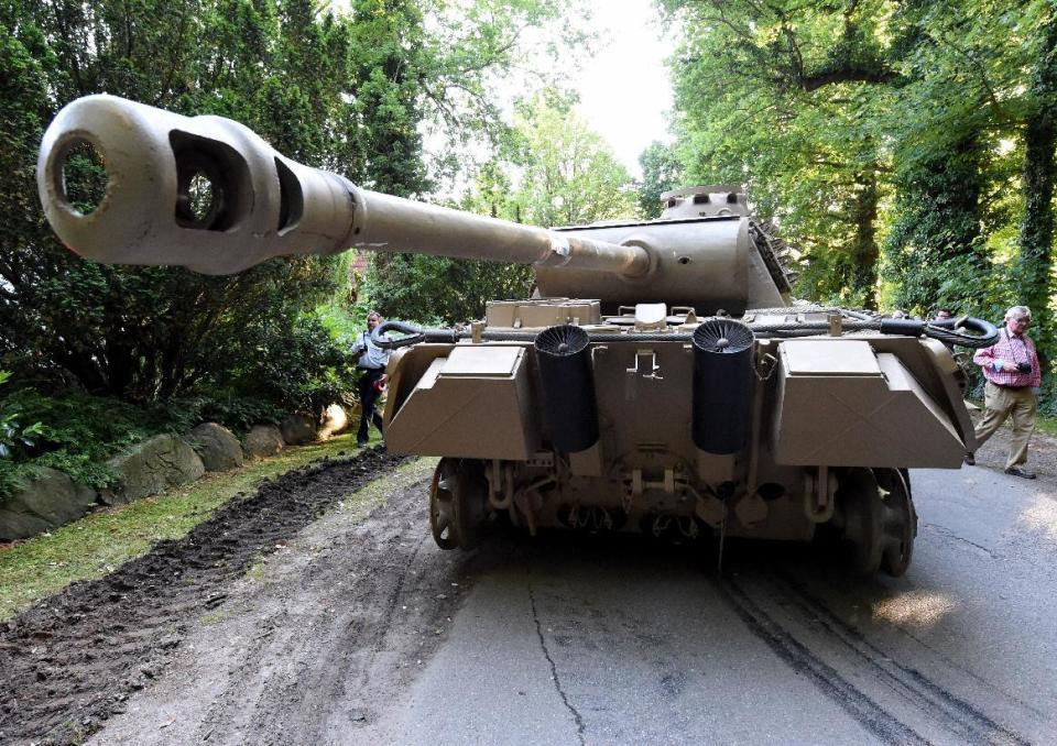 In this July 2, 2015 picture a  World War II  era Panther  tank  is prepared  for transportation from a residential property in Heikendorf,  northern ...